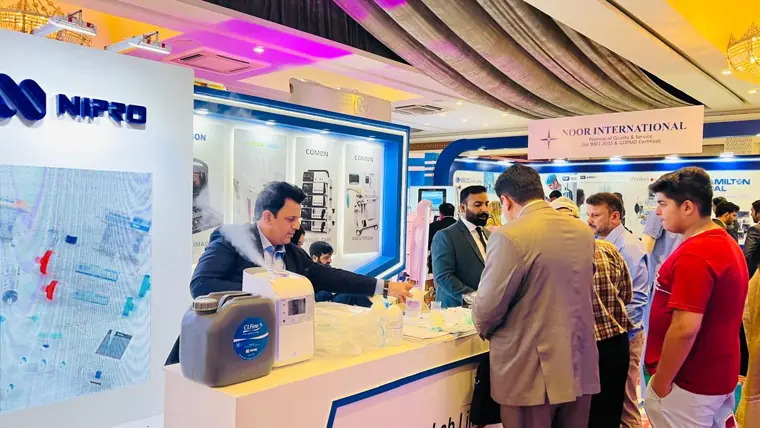 Equipment demonstration at a healthcare exhibition