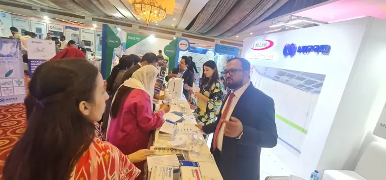 Healthcare professionals at the stand at a healthcare exhibition