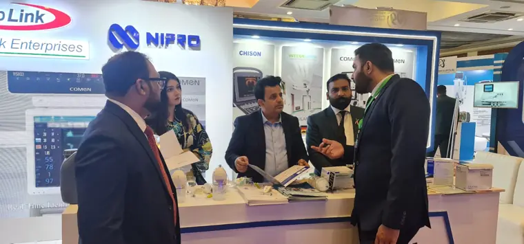 Team discussion at the counter at a healthcare exhibition
