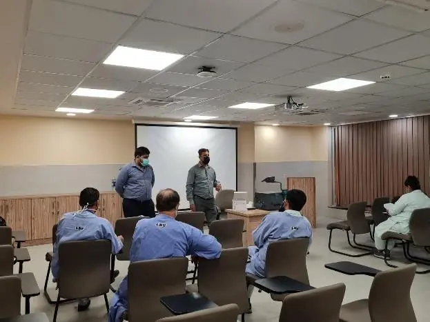 Clinicians attending a continuing medical education session in a hospital lecture hall