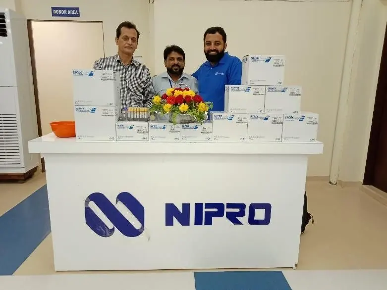 LabLink team at a NIPRO product desk during a hospital event